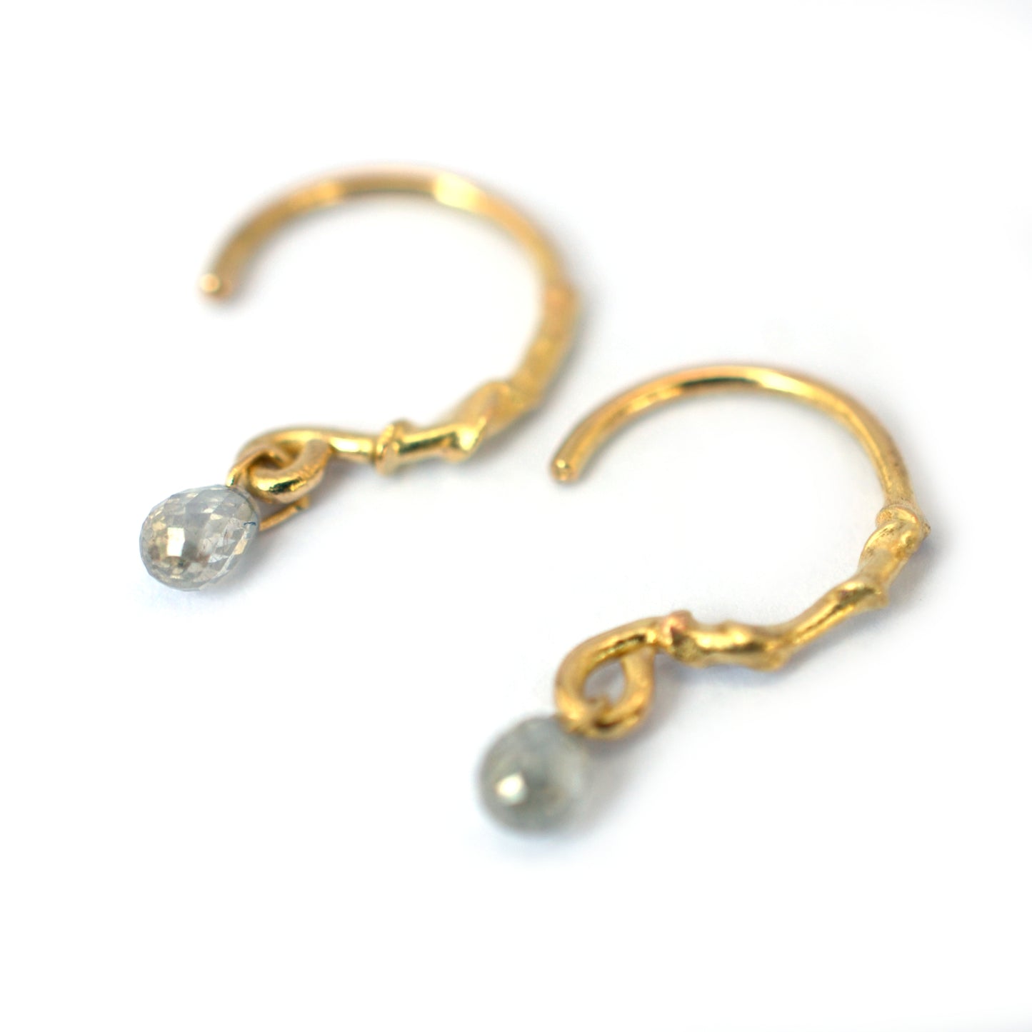 Molten gold hoops with diamond briolette drop