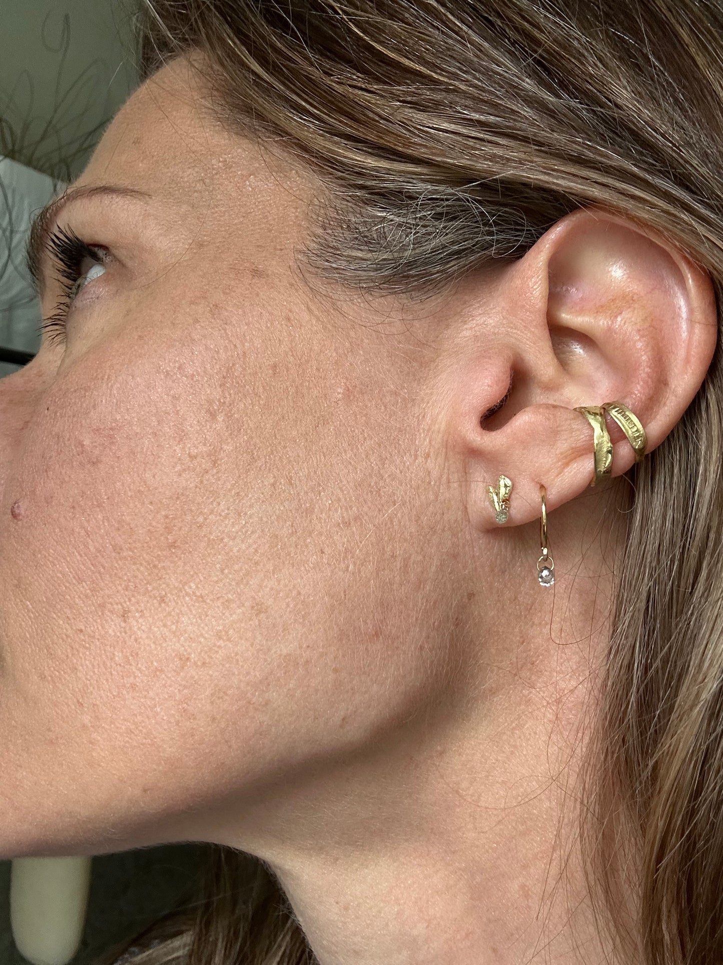 Gold flame stud with diamond briolette